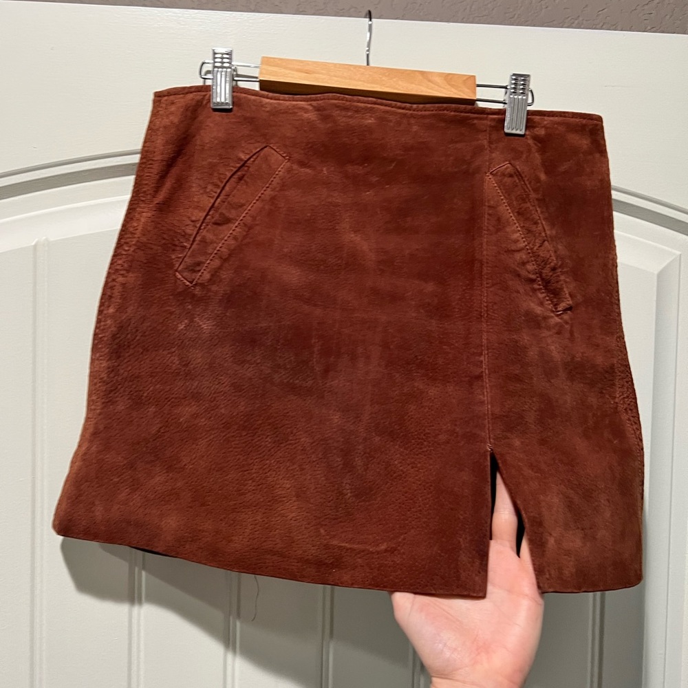 Blank NYC suede leather cognac A-line mini skirt with side slit. Size: 28.